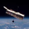 The Hubble Space Telescope (HST) orbits the Earth 370 miles above the atmosphere. It is a space observatory named after Edwin Hubble, launched into orbit in 1990 by NASA.