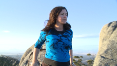 Woman at top of cage