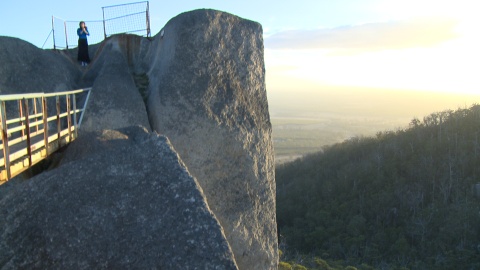 Woman on top of Castle Rock