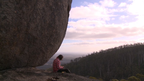 Philosopher sitting on rock