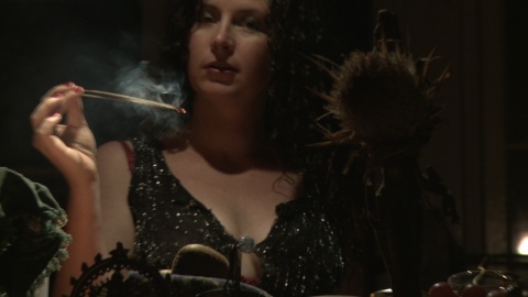 Woman lighting incense